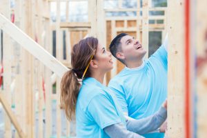 Couple working together to build home for charity